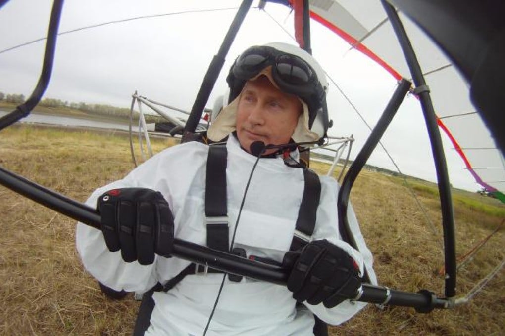 Russian President Vladimir Putin sits in a motorised hand glider at the Kushevat ornithological station near the city of Salekhard in Yamalo-Nenetsky region, Russia, as he takes part in a scientific project as part of the 'Flight of Hope' aiming to preserve Red Book crane species by showing the young birds their flying route. Photo: EPA