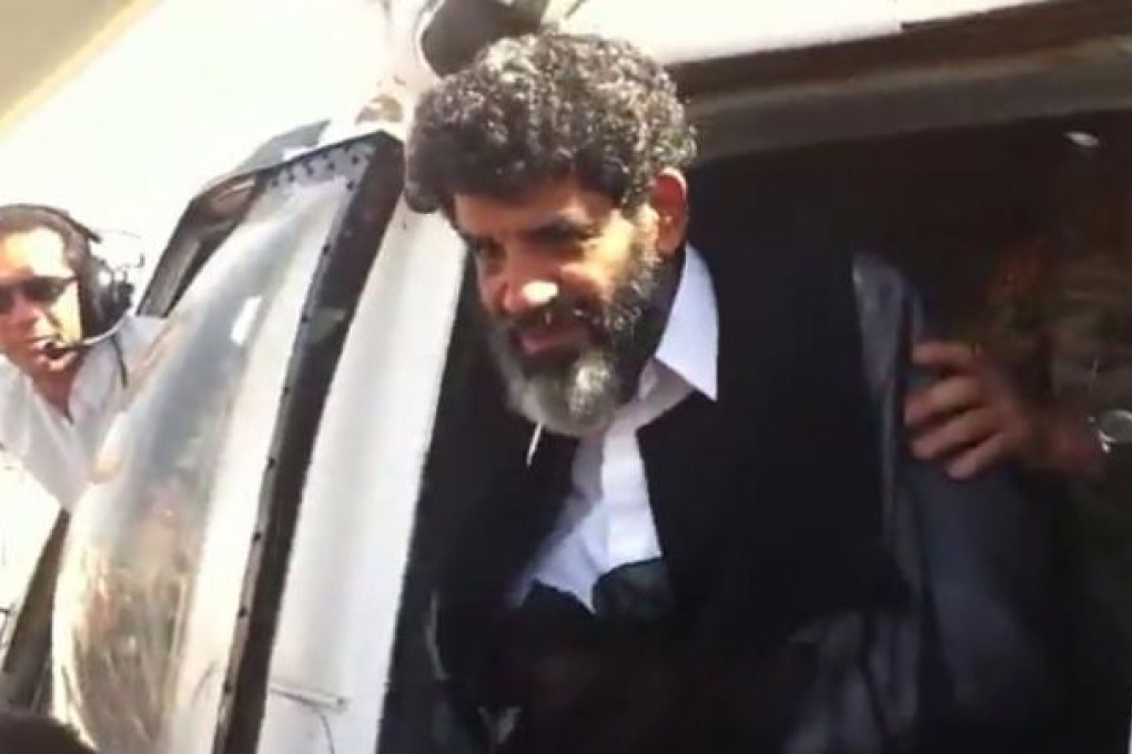 Former spy chief Abdullah al-Senussi arrives in Tripoli on Wednesday, in this video grab. Photo: AFP