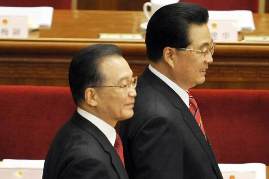 Premier Wen Jiabao (left) and President Hu Jintao make their way in for an opening session of the annual National People’s Congress in Beijing. Photo: AFP