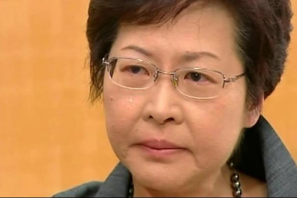 A tear rolls down Chief Secretary Carrie Lam's cheek as she defends tough political choices while on Cable TV. Photo: Cable TV