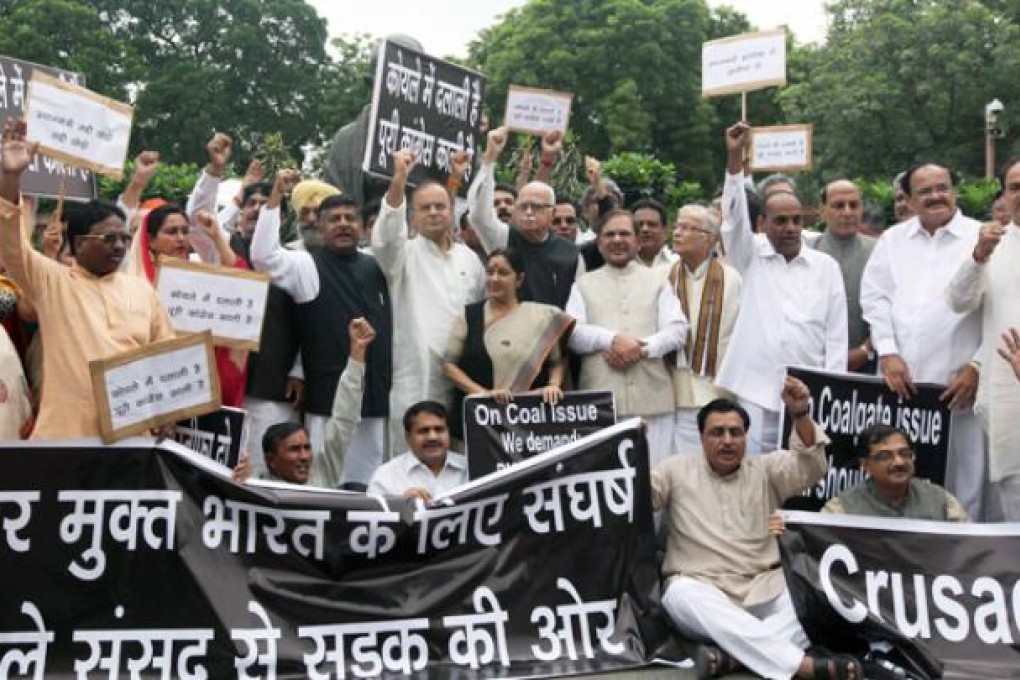 Opposition Members of Parliament shout slogans during a protest in the Parliament compound in New Delhi. Photo: AFP
