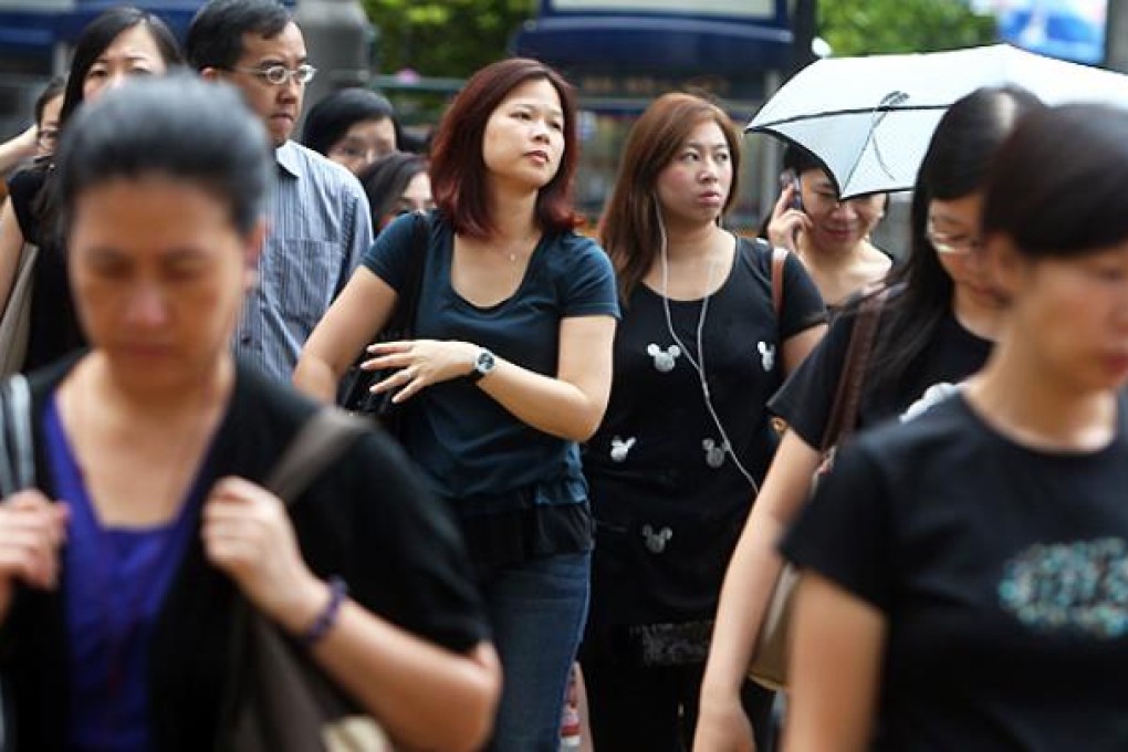 People wear black clothes in Central on Friday to show support for anti-national education protests. Photo: Sam Tsang
