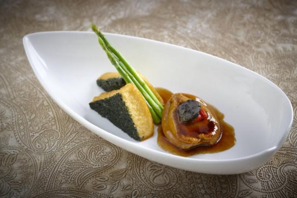 ABALONE, BEAN CURD AND BLACK TRUFFLE SHOWS HOW ASIAN AND EUROPEAN INGREDIENTS ARE COMBINED TO CREATE A DISH AT SHANG PALACE IN THE KOWLOON SHANGRI-LA.