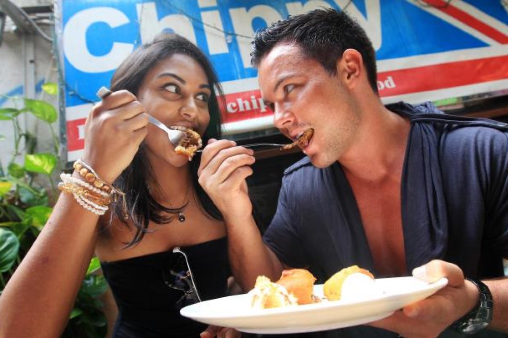 Tourists Sunita Sounder and Tom Williams try the 1,200 calorie dish.