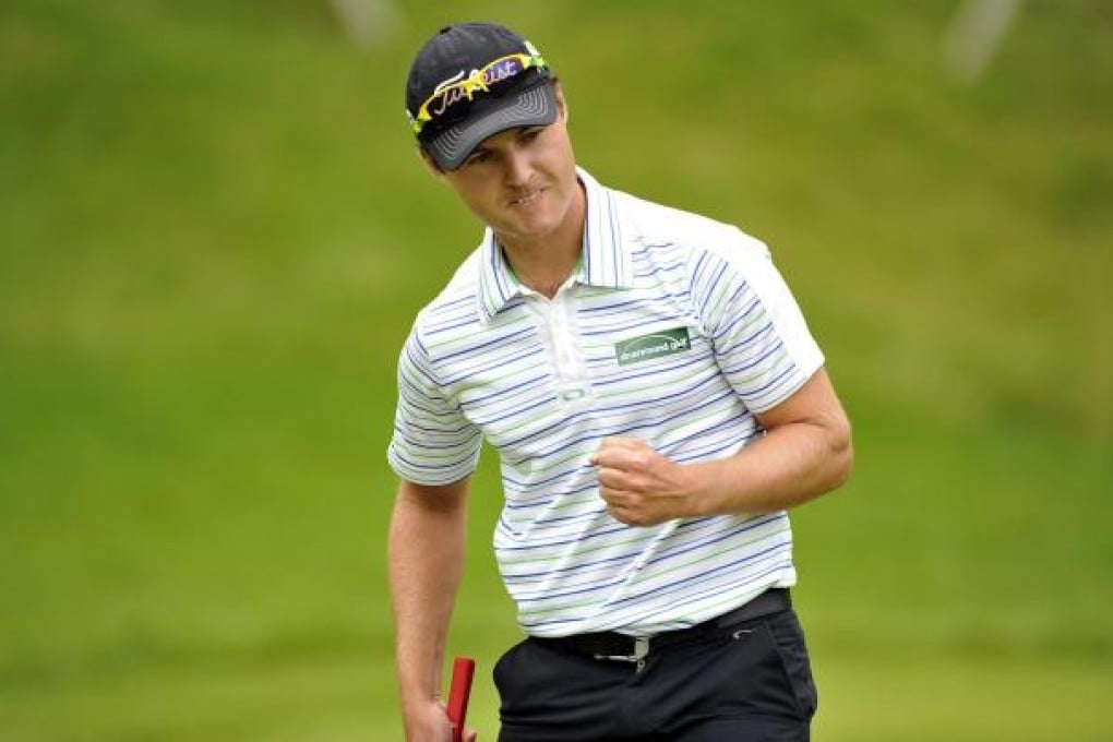 Matthew Griffin celebrates making a putt. Photo: AFP