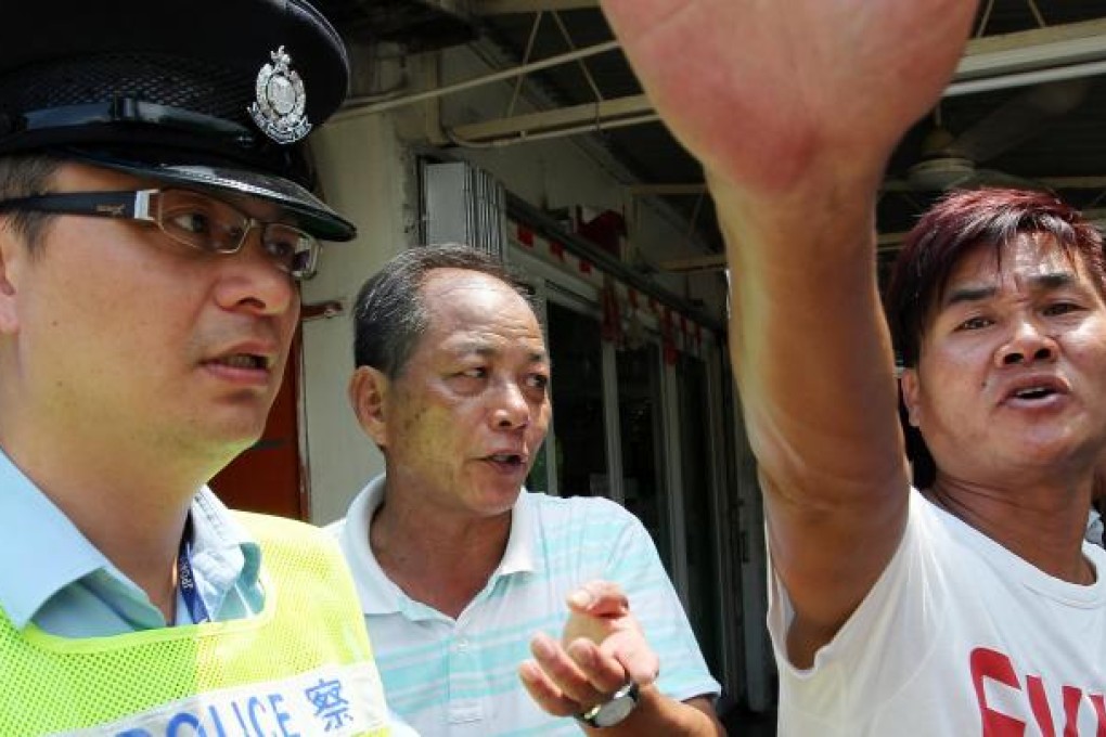 A voter in Yuen Long turns camera-shy. Photo: Nora Tam