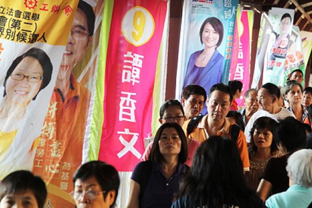 Campaign posters in Kowloon East, where two candidates from the pan-democratic camp hit back at smear campaigns. Photo: Dickson Lee