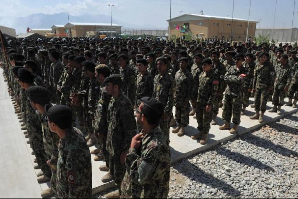 Afghan soldiers stand in formation during the handover ceremony that transferred Bagram prison to Afghan authorities. Photo: AFP