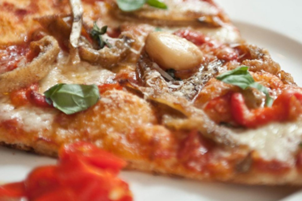 SLICE OF PIZZA AT PIZZERIA PUBBLICO