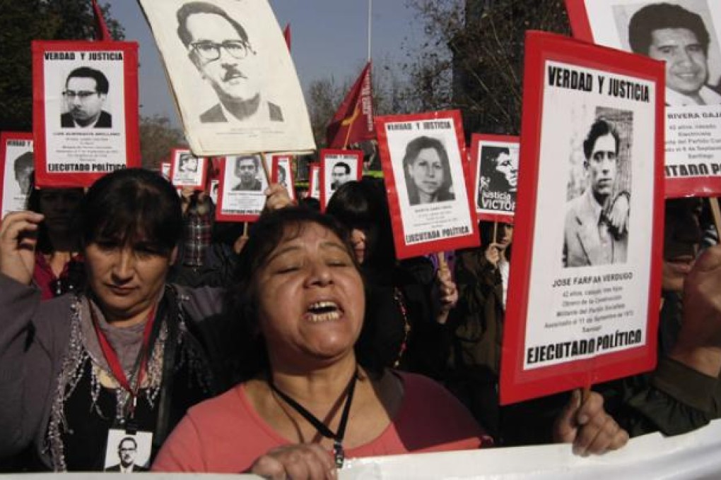 Residents participate in a protest to mark the 39th anniversary of the military coup in Santiago on Sunday. Photo: Xinhua
