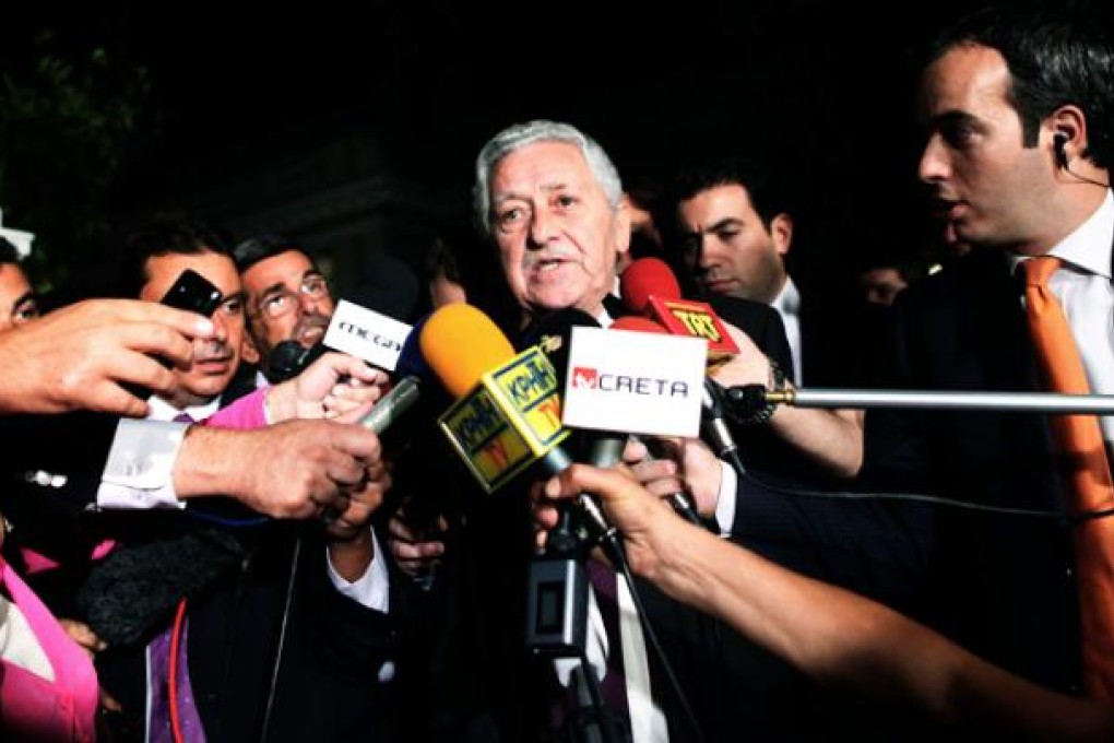 Fotis Kouvelis, leader of the Democratic Left party, addresses the media after a meeting with Greek coalition party leaders in Athens on Sunday. Photo: AP