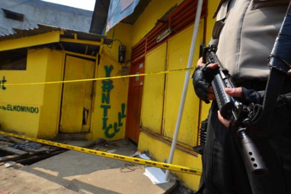 The home of Muhammad Toriq in Jakarta cordoned off after neighbours called police when they saw a cloud of smoke rising from it on Thursday. Photo: AFP