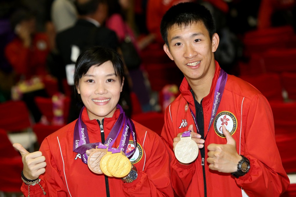 Wheelchair fencing star Yu Chui-yee (left) and runner So Wa-wai return to Hong Kong with medals they won at the London Games. Photo: David Wong