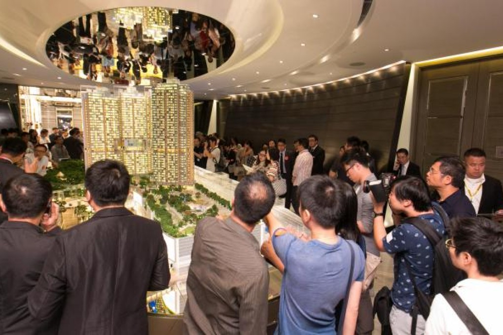 Home buyers pack the sales office of Century Gateway in Tuen Mun. Photo: SCMP