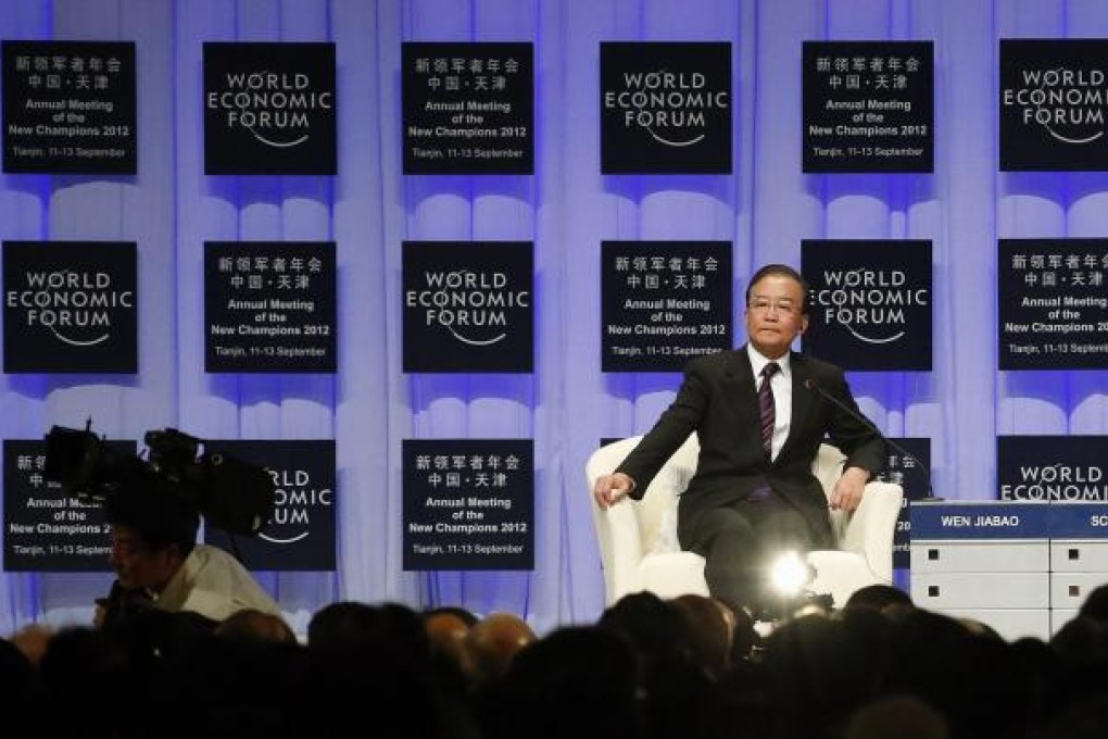Premier Wen Jiabao prepares to speak during a session of the World Economic Forum in the port city of Tianjin yesterday. Photo: Reuters