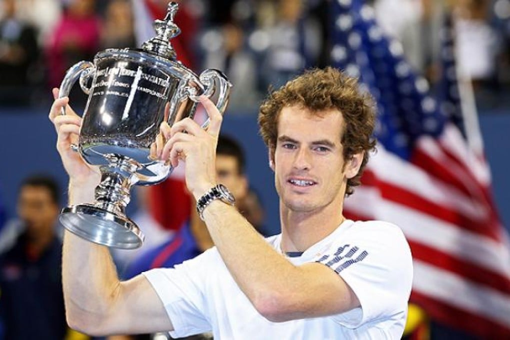 Andy Murray lifts the US Open championship trophy after defeating Novak Djokovic in the final of the US Open in New York. Photo: AFP