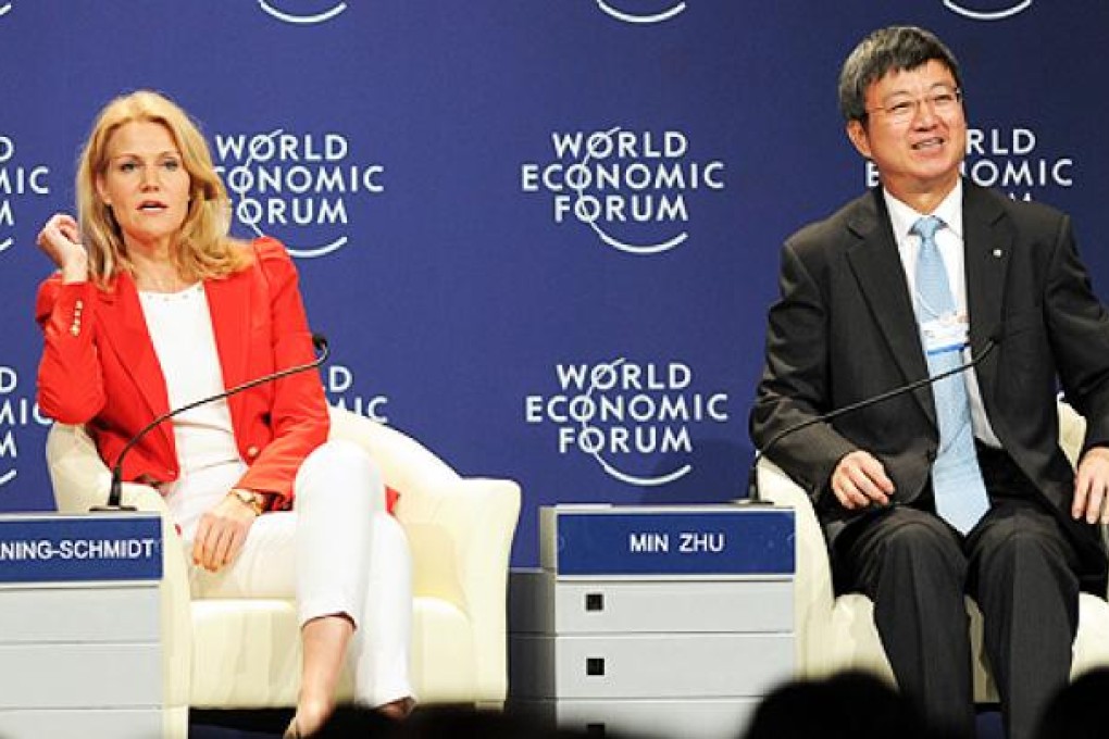International Monetary Fund deputy managing director Zhu Min (right), with Danish Prime Minister Helle Thorning-Schmid, attends an interactive session on the European crisis at the World Economic Forum in Tianjin on Tuesday. Photo: AFP
