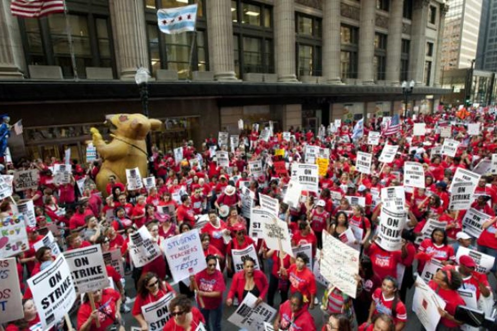 Thousands of public school teachers rally for the second consecutive day outside the Chicago Board of Education district headquarters on Tuesday in Chicago. Photo: AP