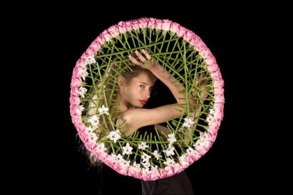 Flower power: A model displays one of Scandinavian Stein Are Hansen's artful creations.