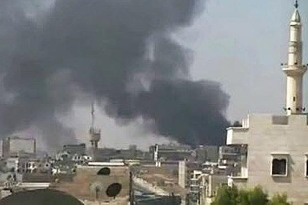 Smoke rising after a shelling by the Syrian army, in the city of Aleppo. Syrian guns pounded rebel positions in Aleppo and heavy fighting rocked the Old City on Tuesday. Photo: AFP