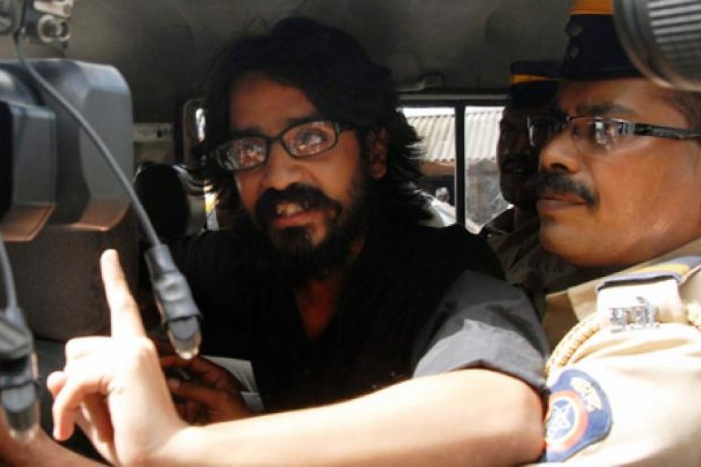 Indian cartoonist Aseem Trivedi is arrested in Mumbai under laws governing sedition. Photo: EPA