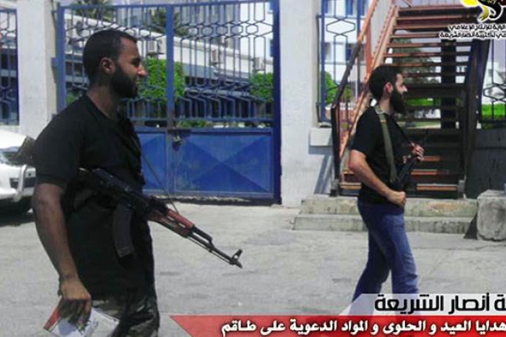 Armed members of Benghazi-based Ansar al-Sharia (Libya),  the group Washington suspects of carrying out the attack on the US Consulate in Benghazi on Monday, are seen in this photo released by the group on Wednesday. Photo: AFP