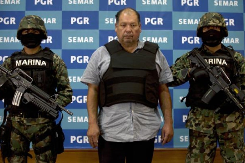 Mario Cardenas Guillen (C), alleged leader of the Gulf drug cartel, during his presentation to the press in Mexico City on September 4, 2012. Photo: AFP