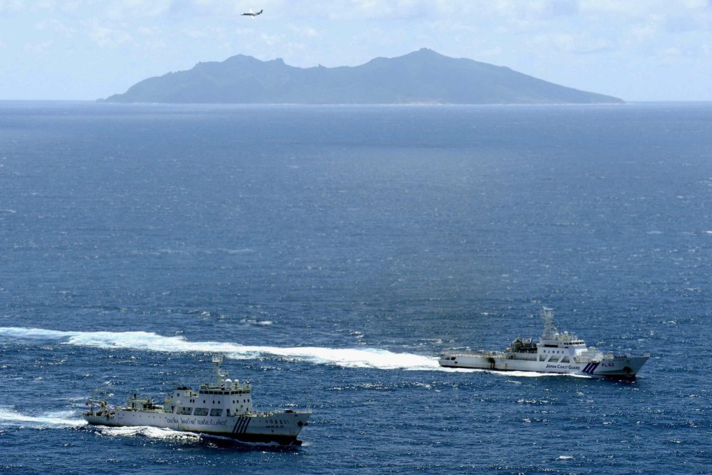 The Chinese marine surveillance ship Haijian No 51 (left) cruises alongside a Japan coastguard ship Ishigaki near Uotsuri island, one of the disputed islands. Photo: Reuters