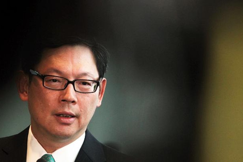 HKMA chief executive Norman Chan talks to the media on Friday. Photo: K.Y. Cheng