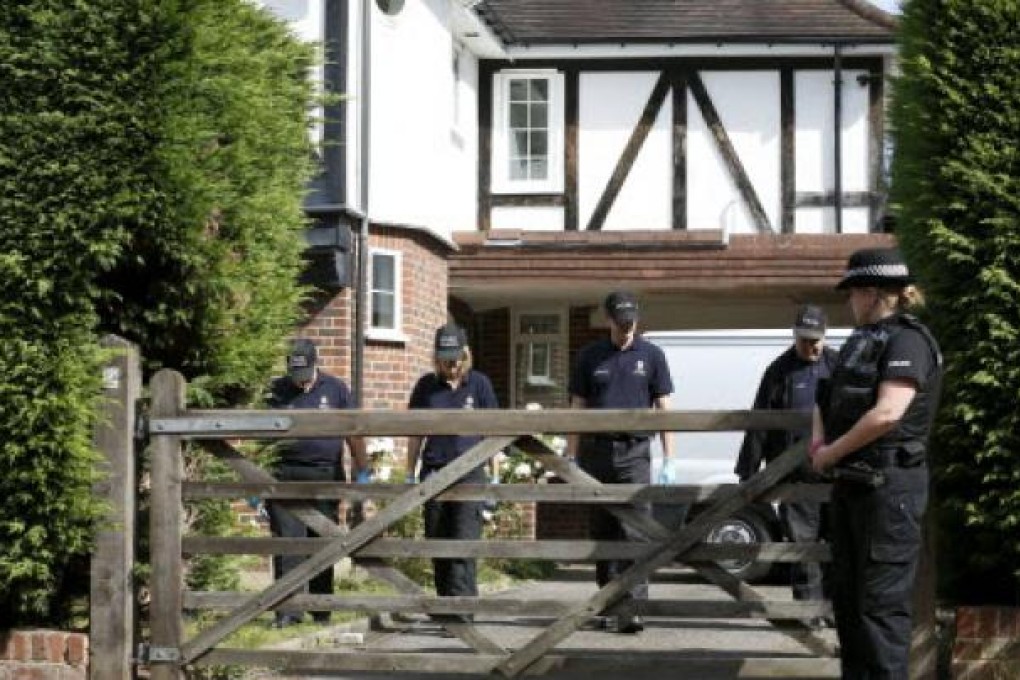 British police search of the garden at the home of Saad and Iqbal al-Hilli in Claygate, in Surrey on Thursday as the investigation into their killing and the killing of two others in the French Alps continues Photo: AFP