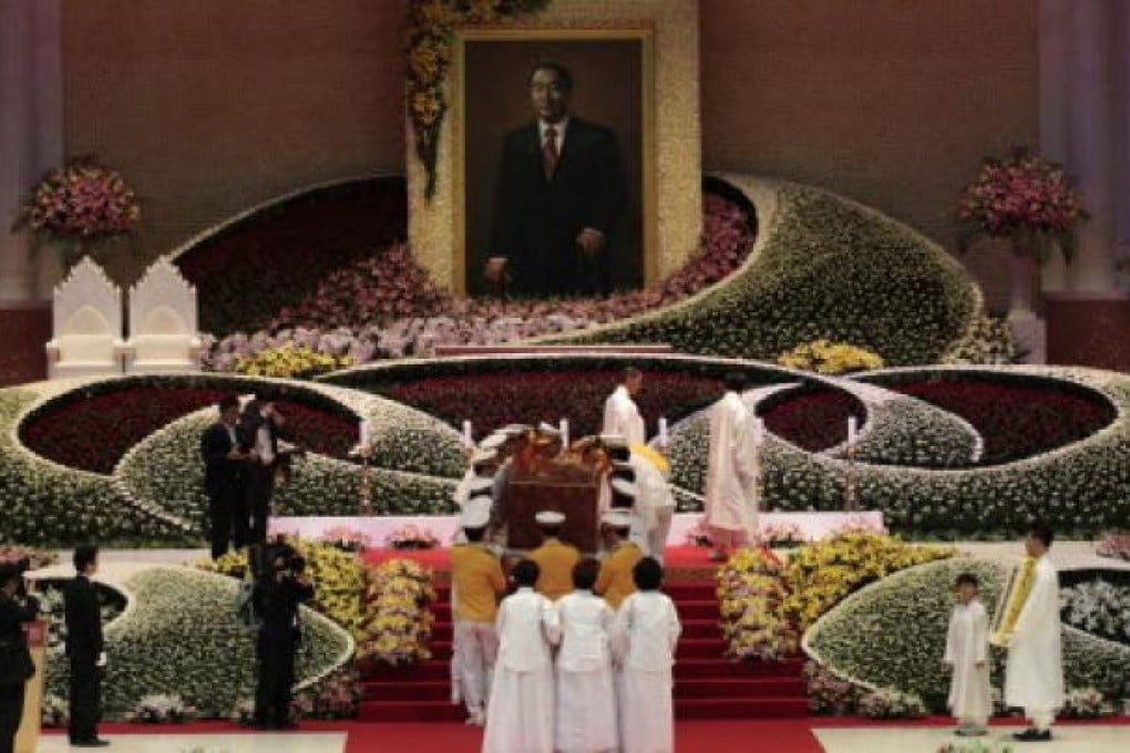 Bereaved family members carry a coffin containing a body of the late Reverend Sun Myung Moon, the founder of the Unification Church, during his funeral service at the CheongShim Peace World Center in Gapyeong in South Korea, on Saturday. Photo: AP
