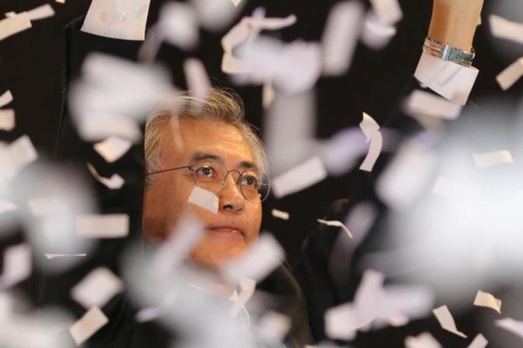 Moon Jae-in reacts after being elected as an opposition presidential candidate yesterday. Photo: AFP