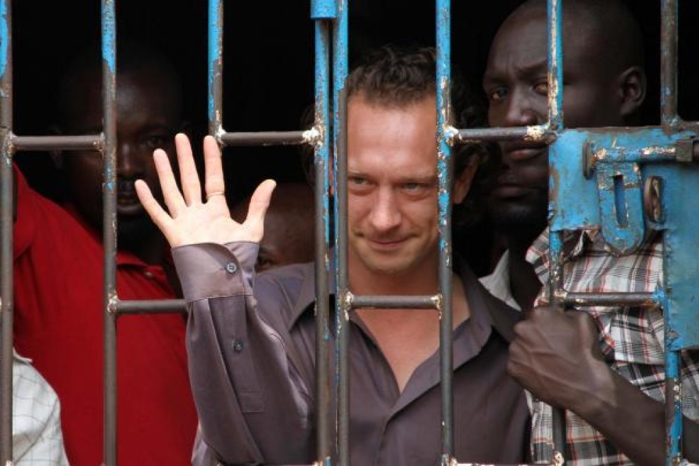 British producer David Cecil waves from a cell. Photo: AFP