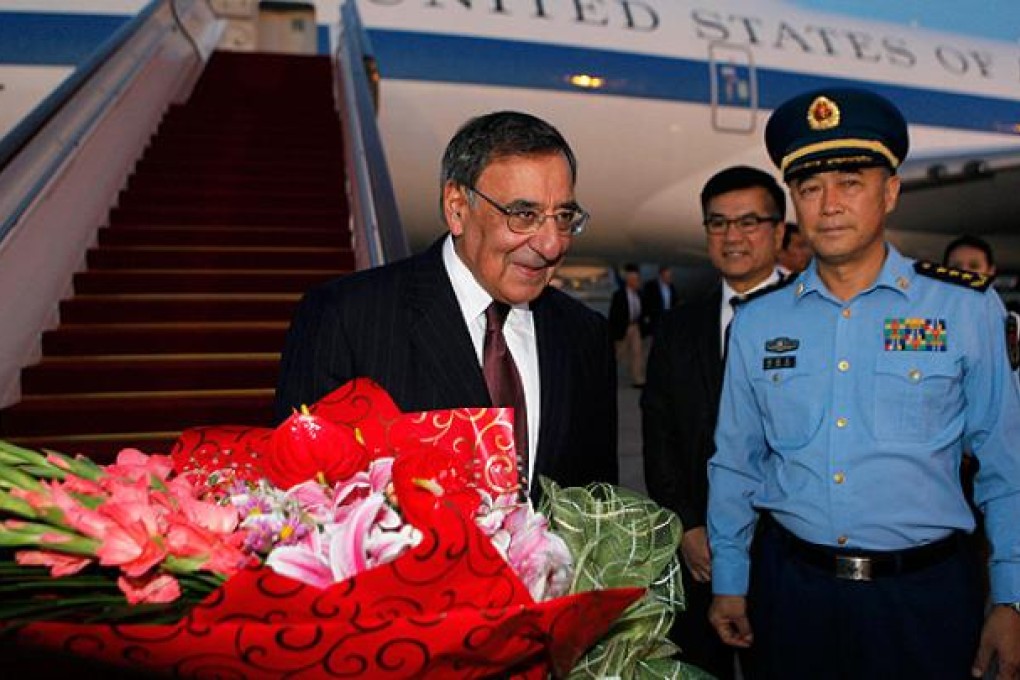US Defence Secretary Leon Panetta is welcomed by China's Chief of the General's Staff Ma Xiao Tian and US Ambassador to China Gary Locke at Beijing International Airport on Monday. Photo: AFP