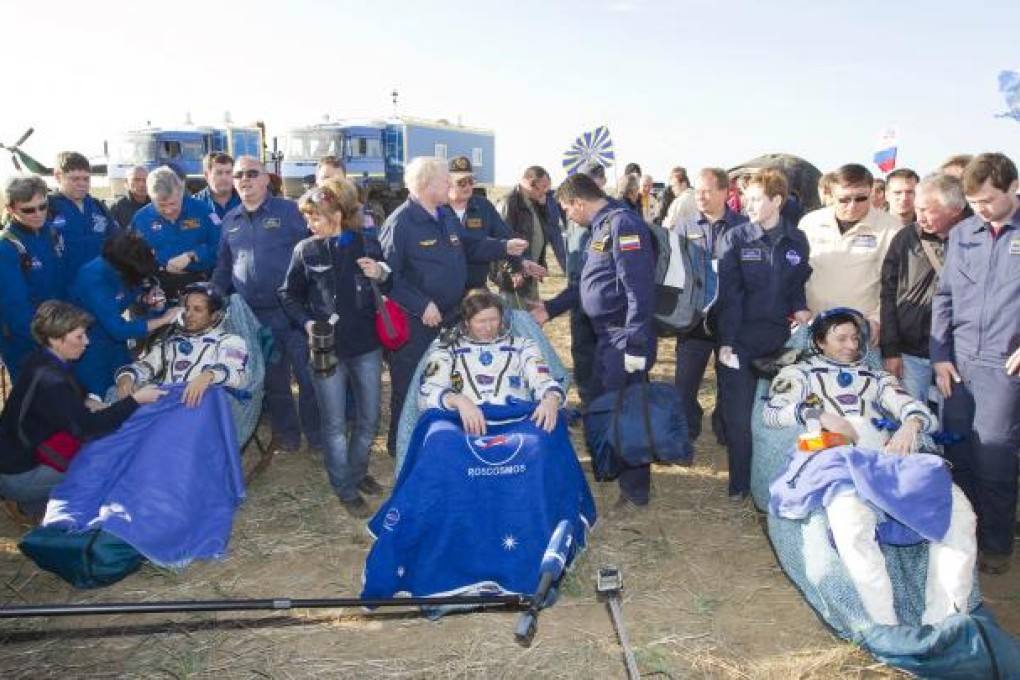 US astronaut Joseph Acaba (left) and Russian cosmonauts Gennady Padalka and Sergei Revin pictured shortly after landing near the town of Arkalyk in northern Kazakhstan. Photo: AFP