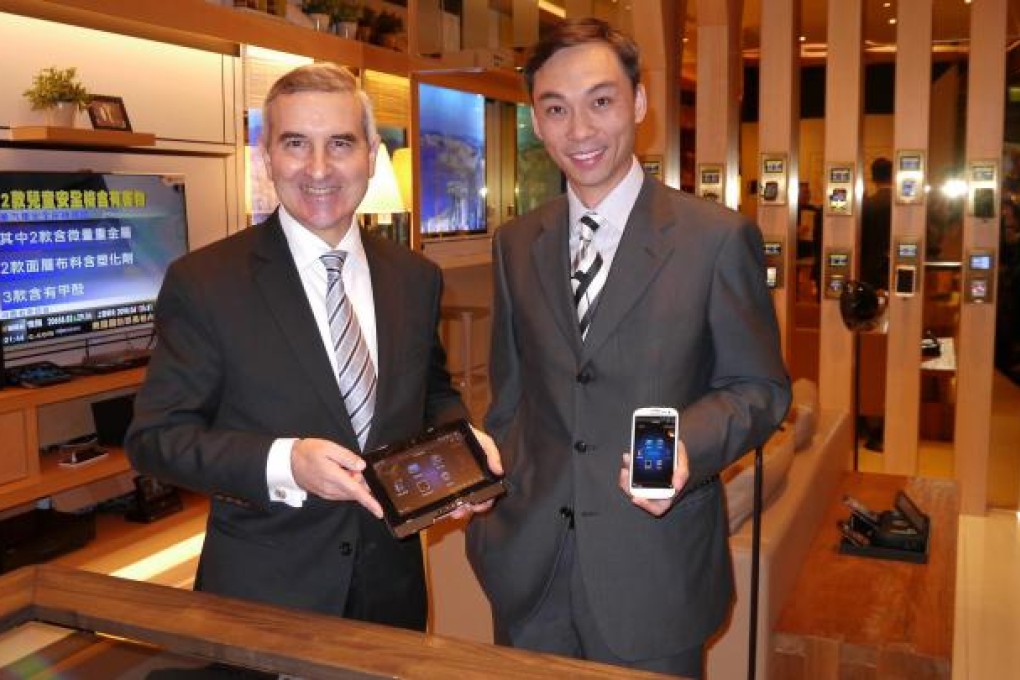 Alex Arena and PCCW's Ringo Ng unveil the "Smart Living" concept at a mock-up of the firm's newly designed retail store. Photo: SCMP