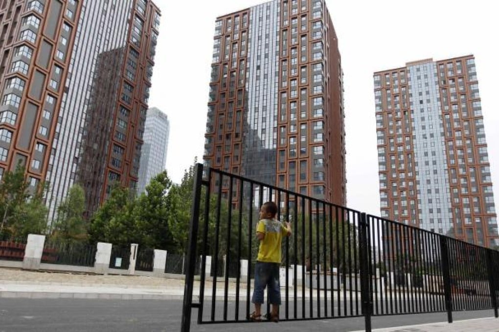 Newly built apartment blocks in Beijing. The central government is planning to stop building subsidised housing after 2015. Photo: Reuters