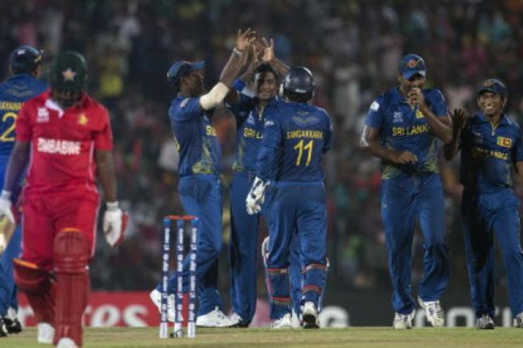 Sri Lanka's bowler Ajantha Mendis, centre facing, celebrates the dismissal of Zimbabwe's Prosper Utseya during the ICC Twenty20 Cricket World Cup match between Sri Lanka and Zimbabwe in Hambantota, Sri Lanka, on Tuesday. Photo: AP