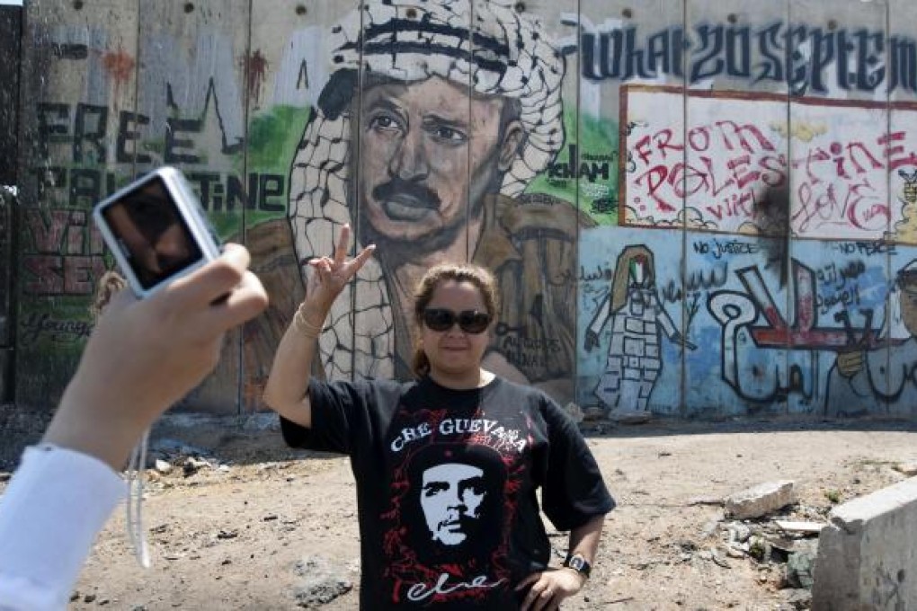 A tourist at Kalandia checkpoint. Photo: AFP