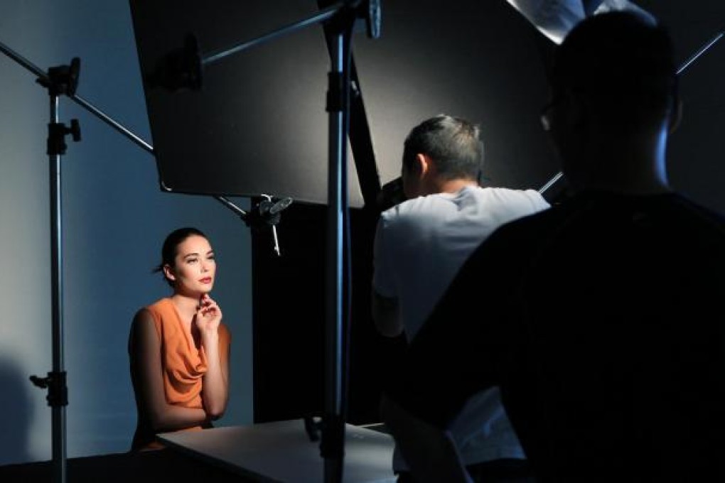 Joy perfects her cover pose for photographer Dan Pak. Photo: Jonathan Wong