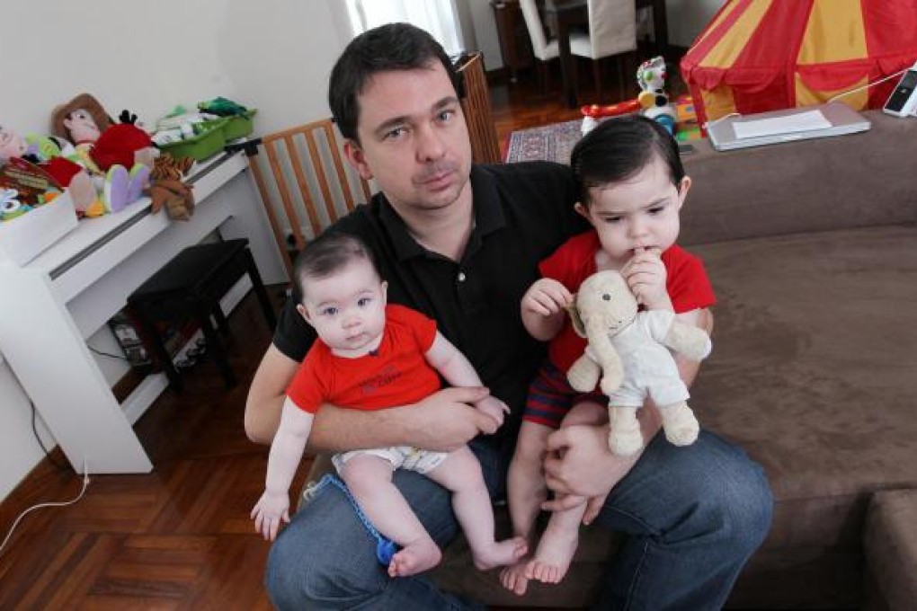 Academic with his two children, aged 18 and 8 months. Photo: SCMP