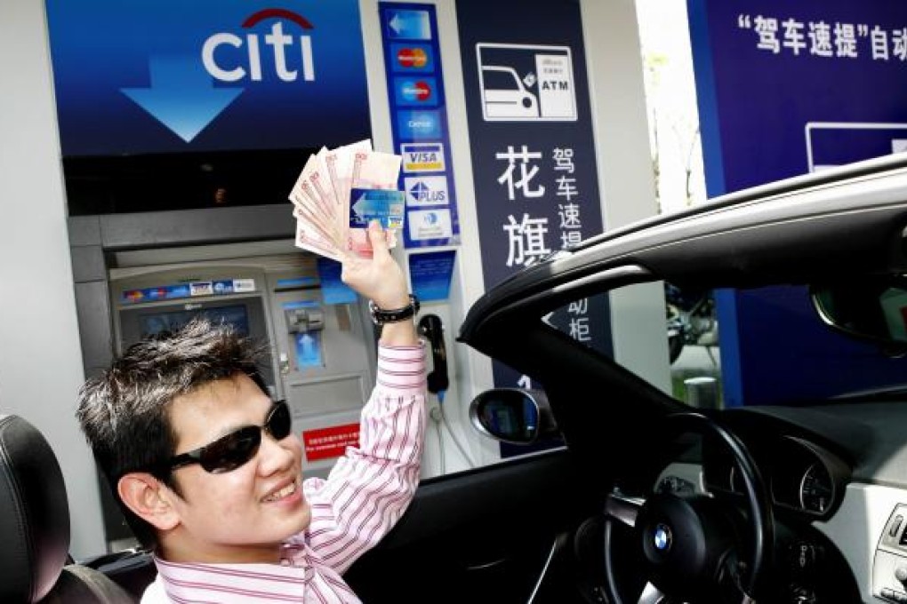 This August 3, 2007 file photo shows Citibank's first drive-through ATM customer at the Upper East Side of the Central Plaza in Beijing. Photo: SCMP
