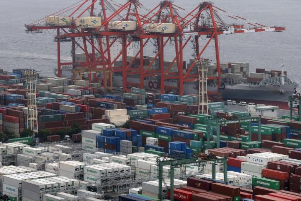 In this July 25, 2012 file photo, containers pack a container terminal at a pier in Tokyo. Photo: AP