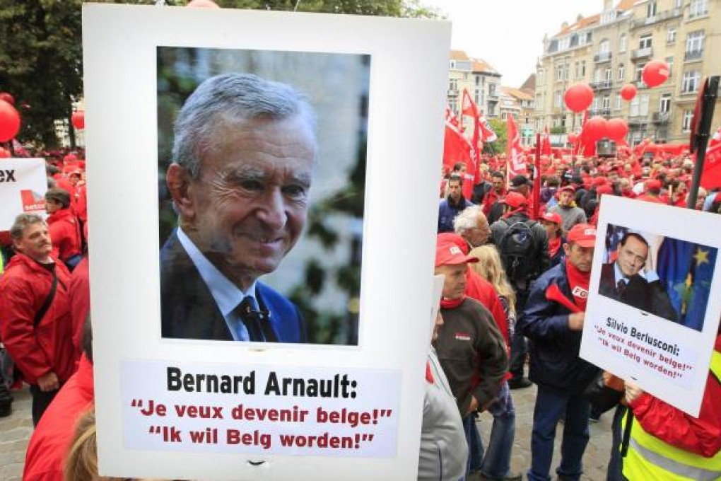 Workers protest against lower taxes for the rich in Belgium. Photo: Reuters