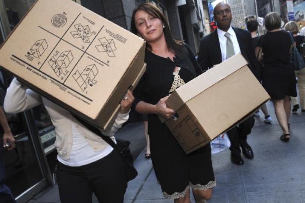 Women carrying boxes leave the Lehman Brothers headquarters in New York. The Australian arm of the 158-year-old investment bank bought Grange Securities in 2007.