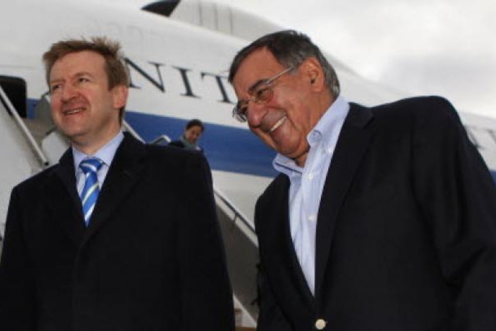 US Secretary of Defence Leon Panetta (right) is welcomed to Auckland by New Zealand's Minister of Defence Jonathan Coleman on Friday. Photo: AFP