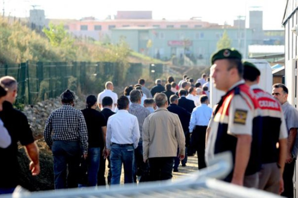 Turkish soldiers arrive to the court building in Silivri, near Istanbul, on Thursday ahead of a trial in a landmark case over an alleged 2003 plot to oust the Islamist-rooted government. Photo: AFP