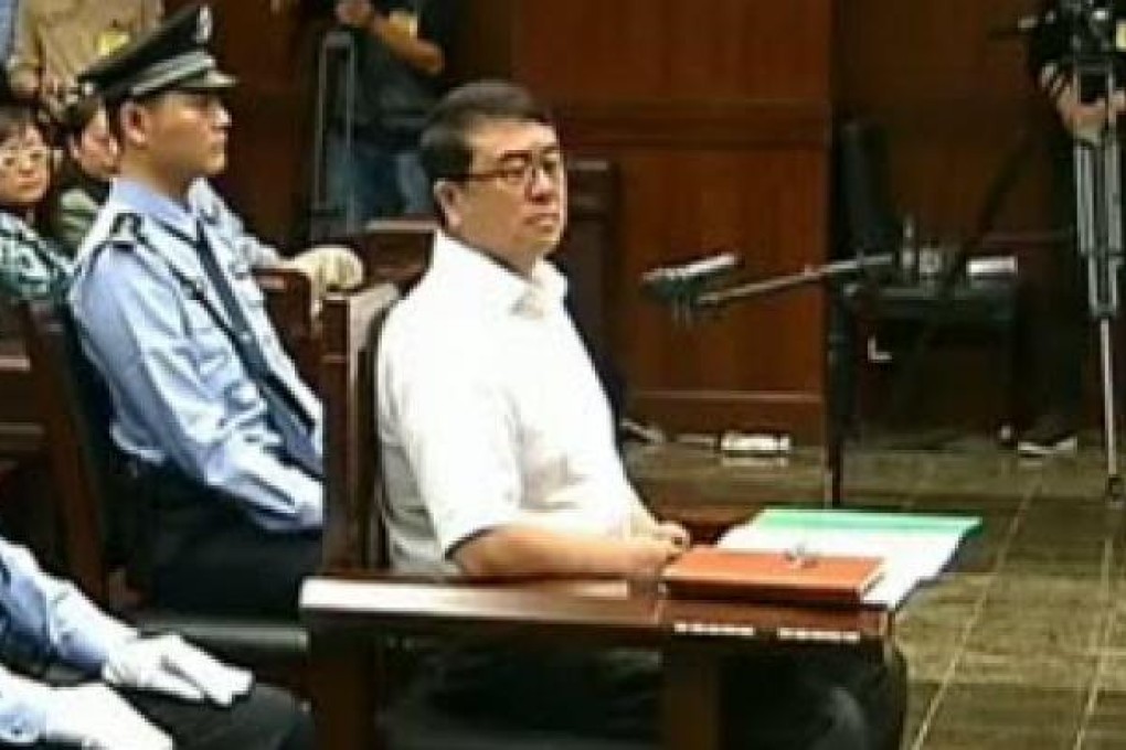 Former police chief Wang Lijun (right) facing the court during his trial in Chengdu, in southwest Sichuan province. Photo: AFP