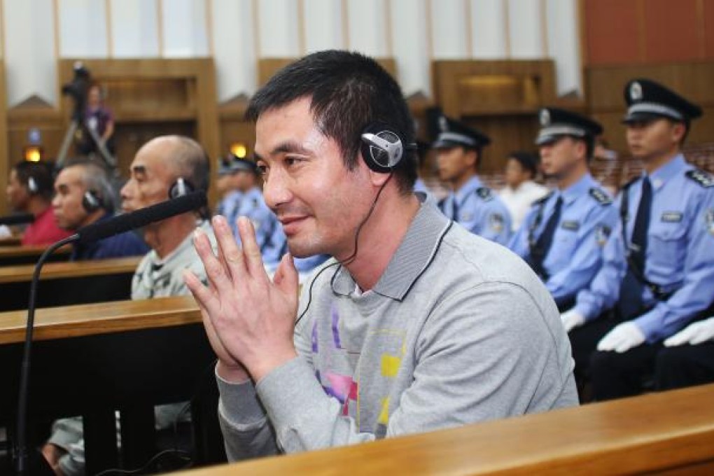 Naw Kham, principal suspect for the murders of 13 Chinese sailors on the Mekong River last year, pleaded guilty Friday evening at the Intermediate People's Court of Kunming, capital of Yunnan Province. Photo: Xinhua
