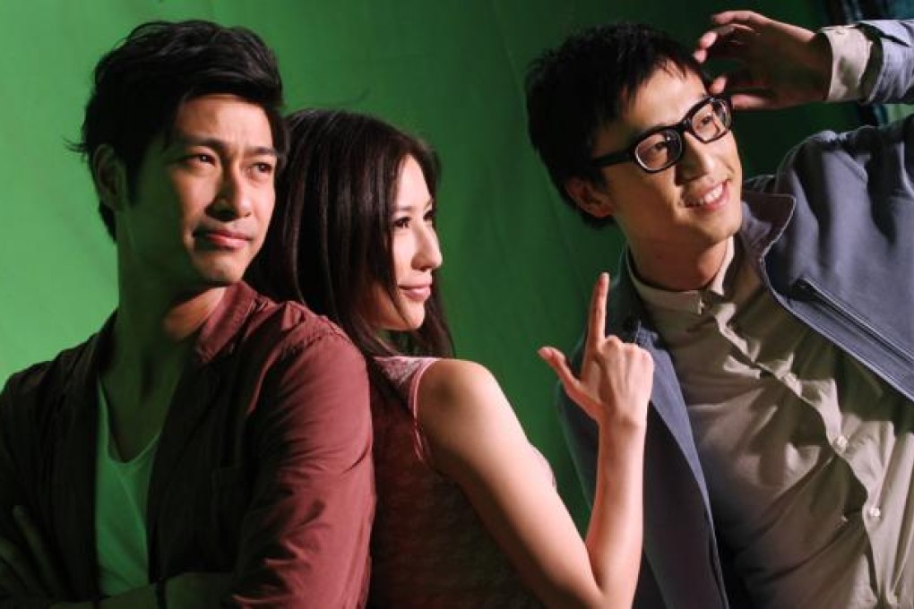 Actors Justin Cheung (right) and Gregory Wong (left) pose for picture with other cast member during the filming of movie "Due West: My Sex Journey".